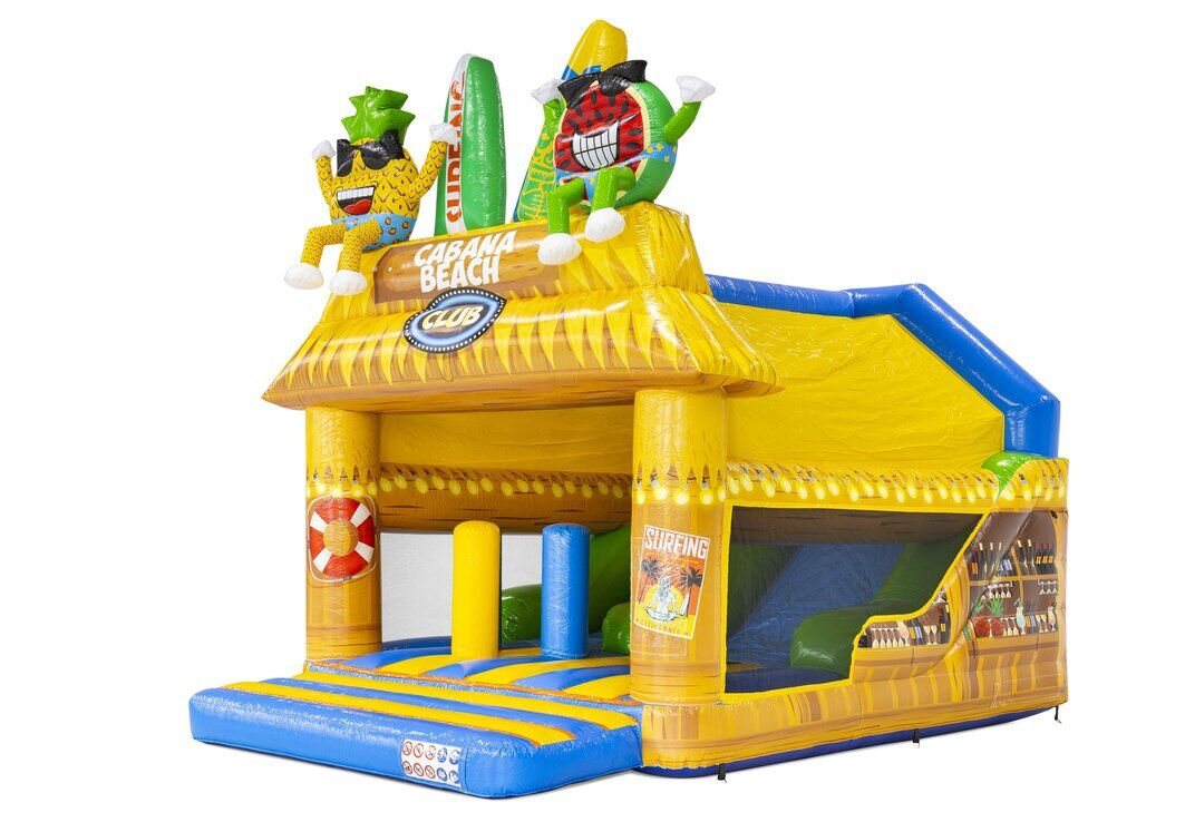 Inflatable bouncy castle Combounce Caribbean, featuring a colourful design with a tropical bar and cheerful characters.