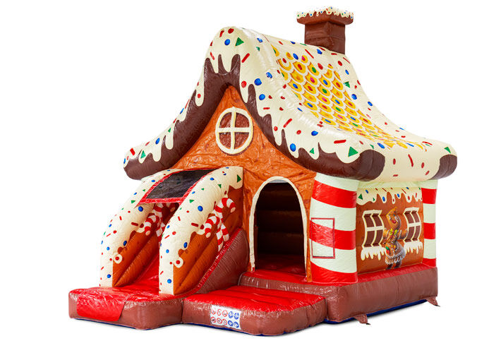 Château gonflable thème maison en pain d'épices avec toboggan à vendre chez JB à Meppel