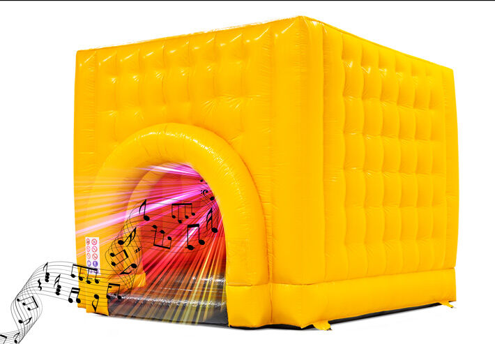 Colorful gold yellow bouncy castle with disco theme featuring disco lights and music inside