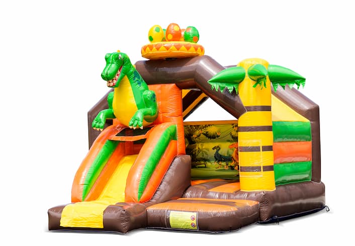 Inflatable slide combo bouncy castle in dinosaur theme for sale at JB Inflatables UK. Order inflatable bouncy castles with slide for kids
