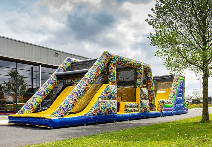 Bouncy castle with slide and obstacles