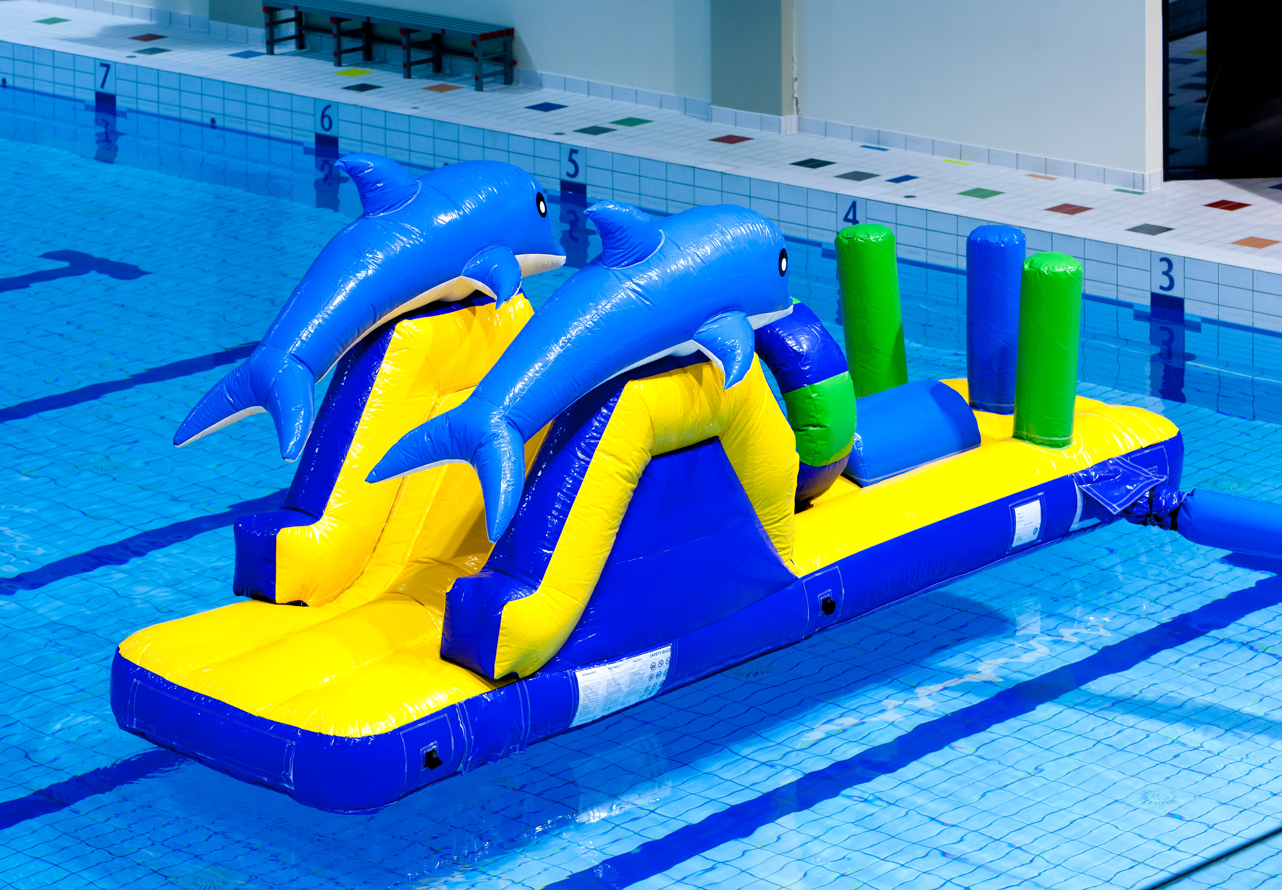 Buy an inflatable dolphin run slide with fun objects for both young and old. Order inflatable water attractions now online at JB Inflatables America